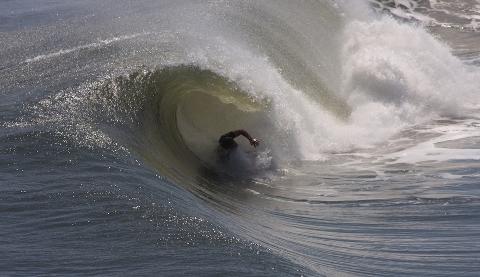 This guy is either a terrific bodysurfer or he just blew a fun little tube.  Jennettes Pier.  Photo: Mickey McCarthy.